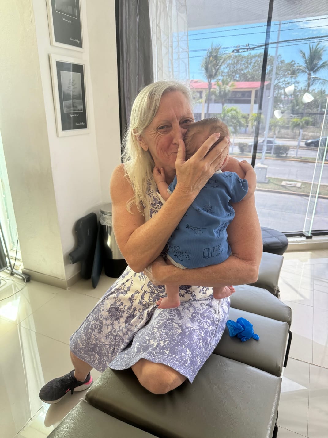 Dr. Susan Colby gently holding an infant patient at the clinic