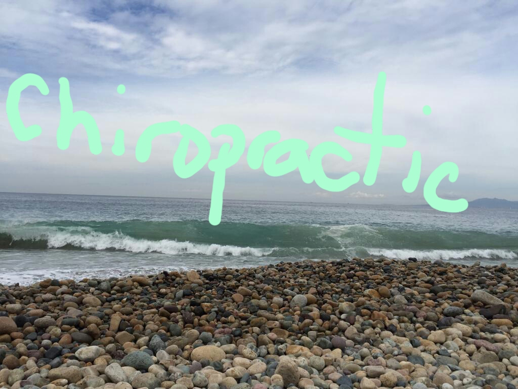 Rocky Beach Side looking out over ocean with positive cheery Chiropractic written in